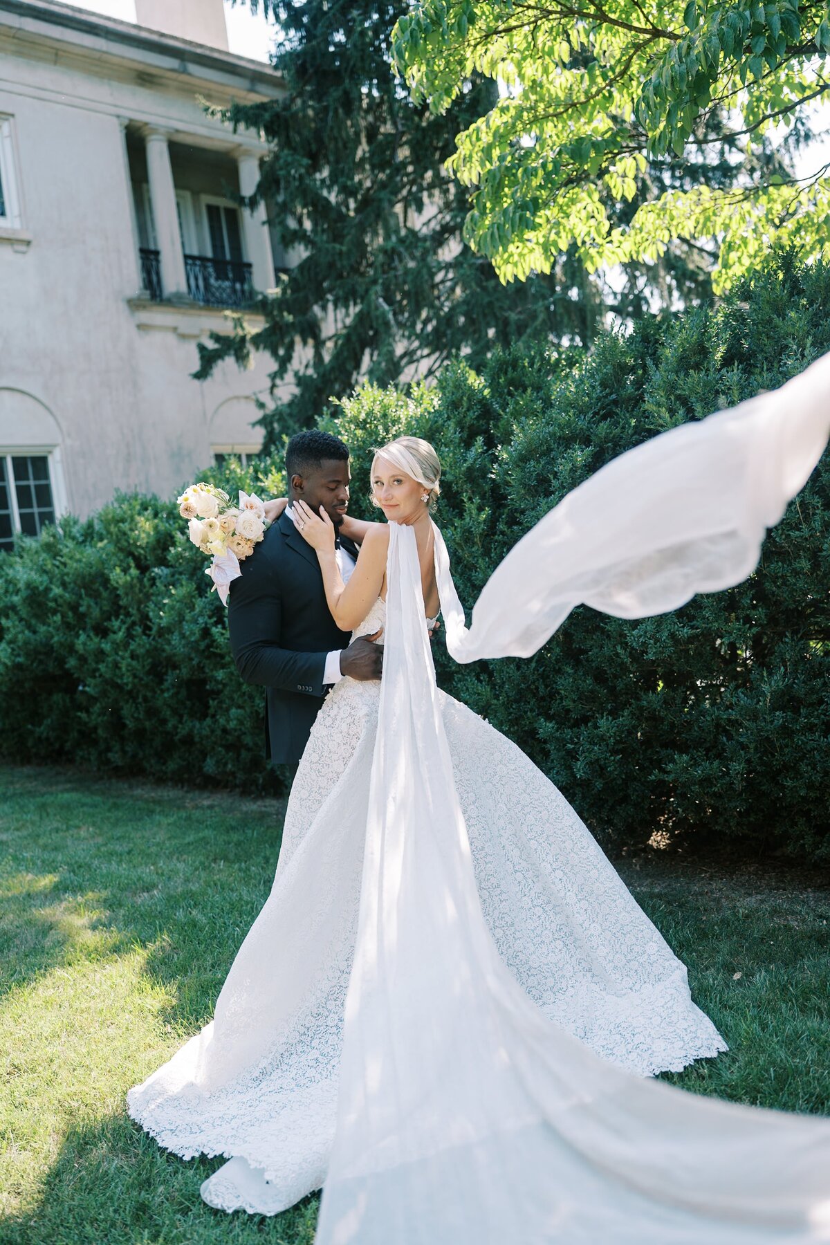 Bride and Groom holding eachother outside
