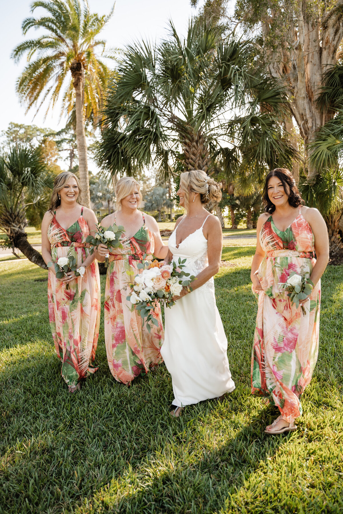 bridesmaids walking in floral dresses at the fenway in dunedin florida