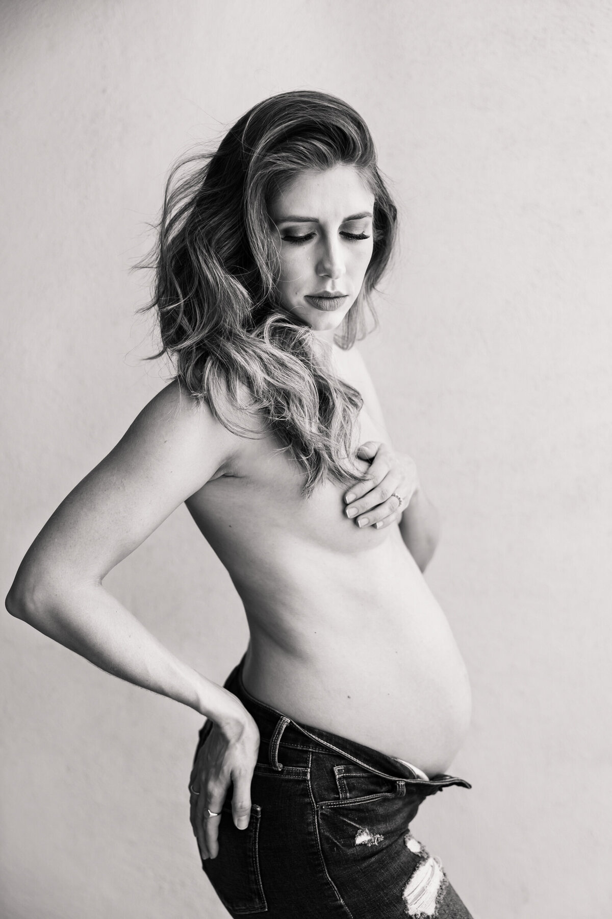 pregnant woman posing  for at home lifestyle maternity photography session