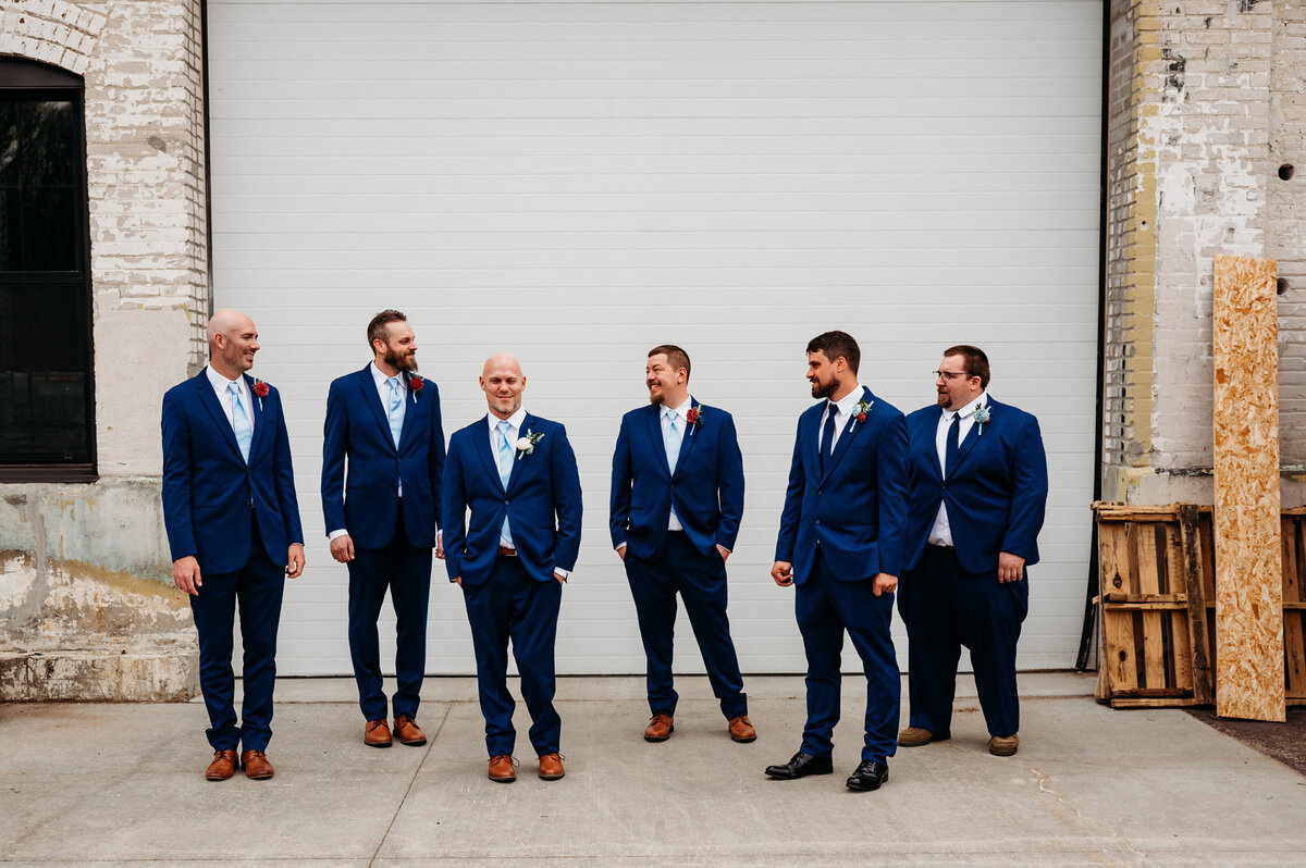 Grooms and groomsmen hanging out