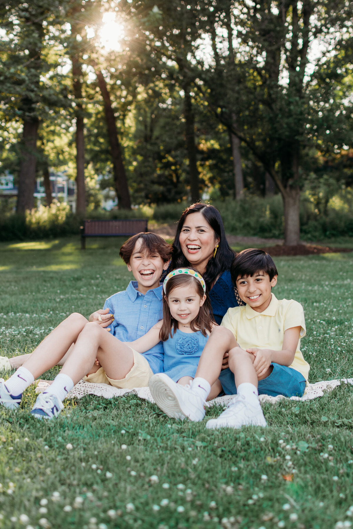 Fun, candid photo of a family by Lake Ellyn, by Moments by Meli