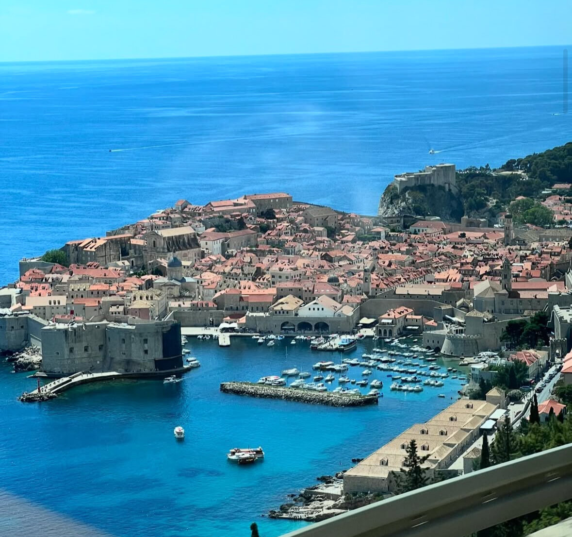 Blue seas with architecture and a boat dock