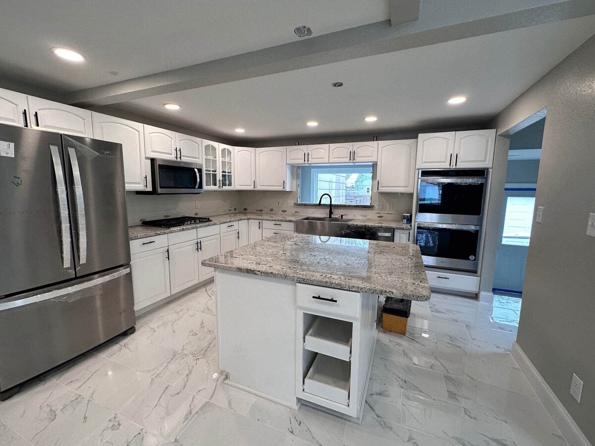 granite-countertops-white-cabinets-kicthen-remodel-2