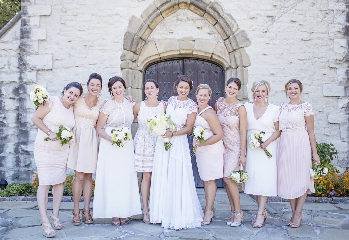 bridesmaids and sisters in pale pinks and neutral tone dresses. Milwaukee wedding