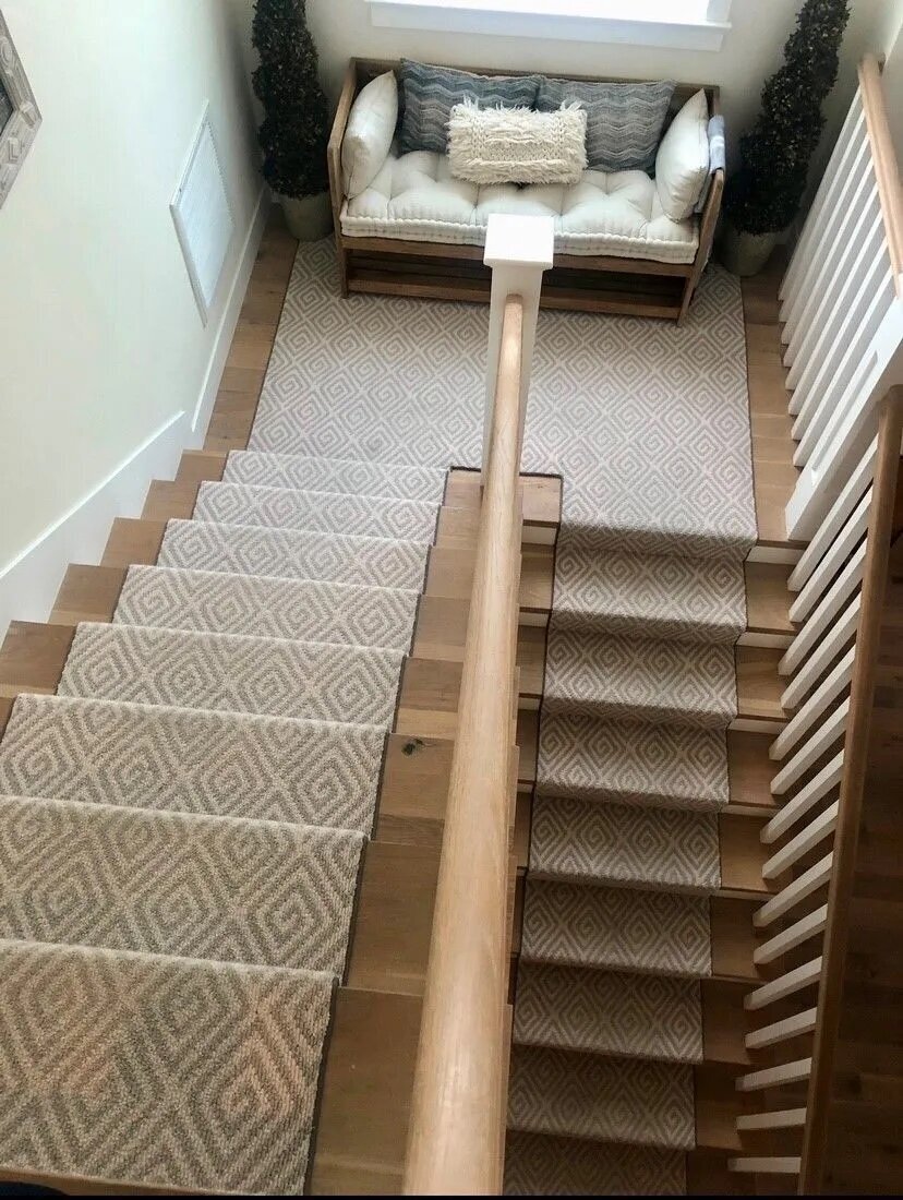 Cozy stair landing with reading nook and patterned runner