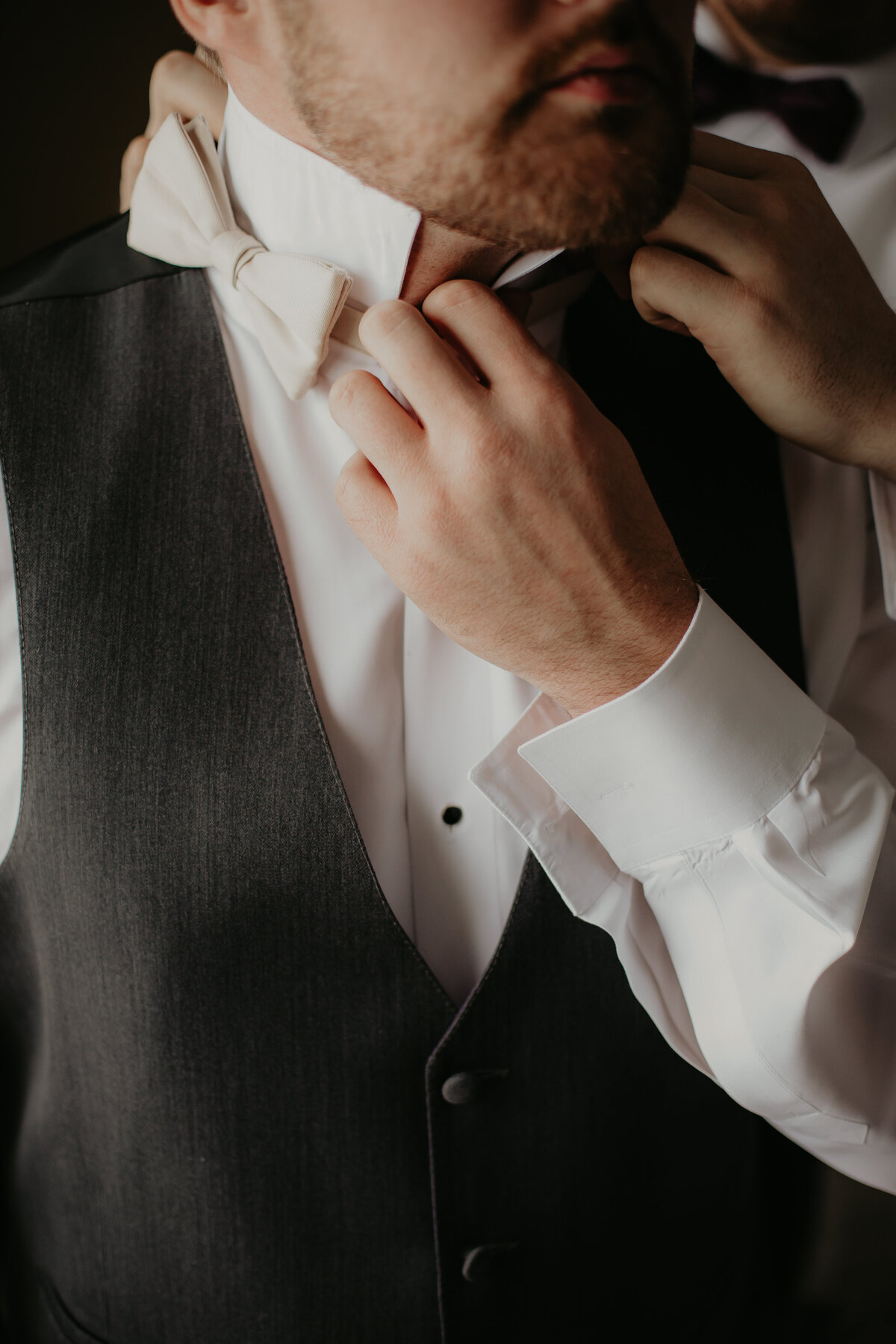 GROOM GETTING READY WITH HELP OF HIS DAD FOR HIS WEDDING DAY