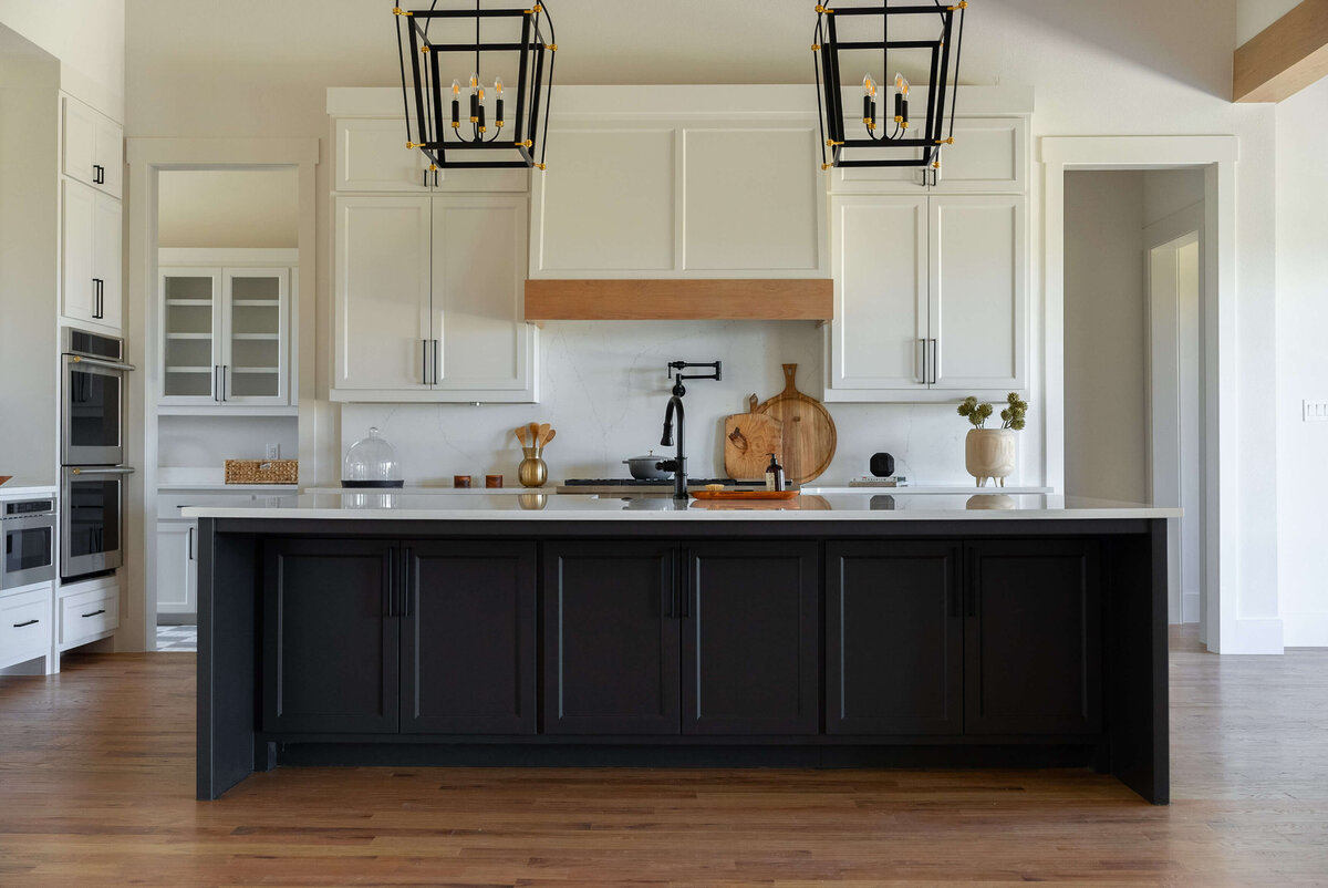 Luxurious custom kitchen with dark paint and wood accents