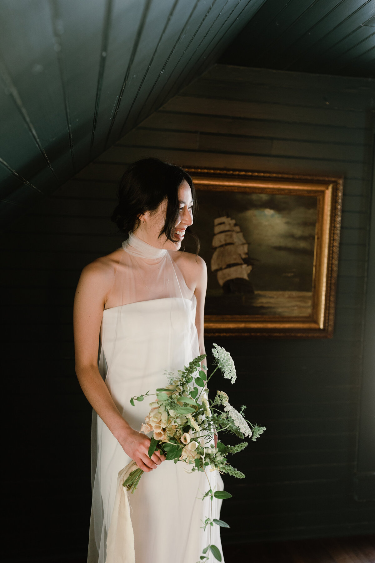 Bride standing in front of a framed print at  Mattie's Austin