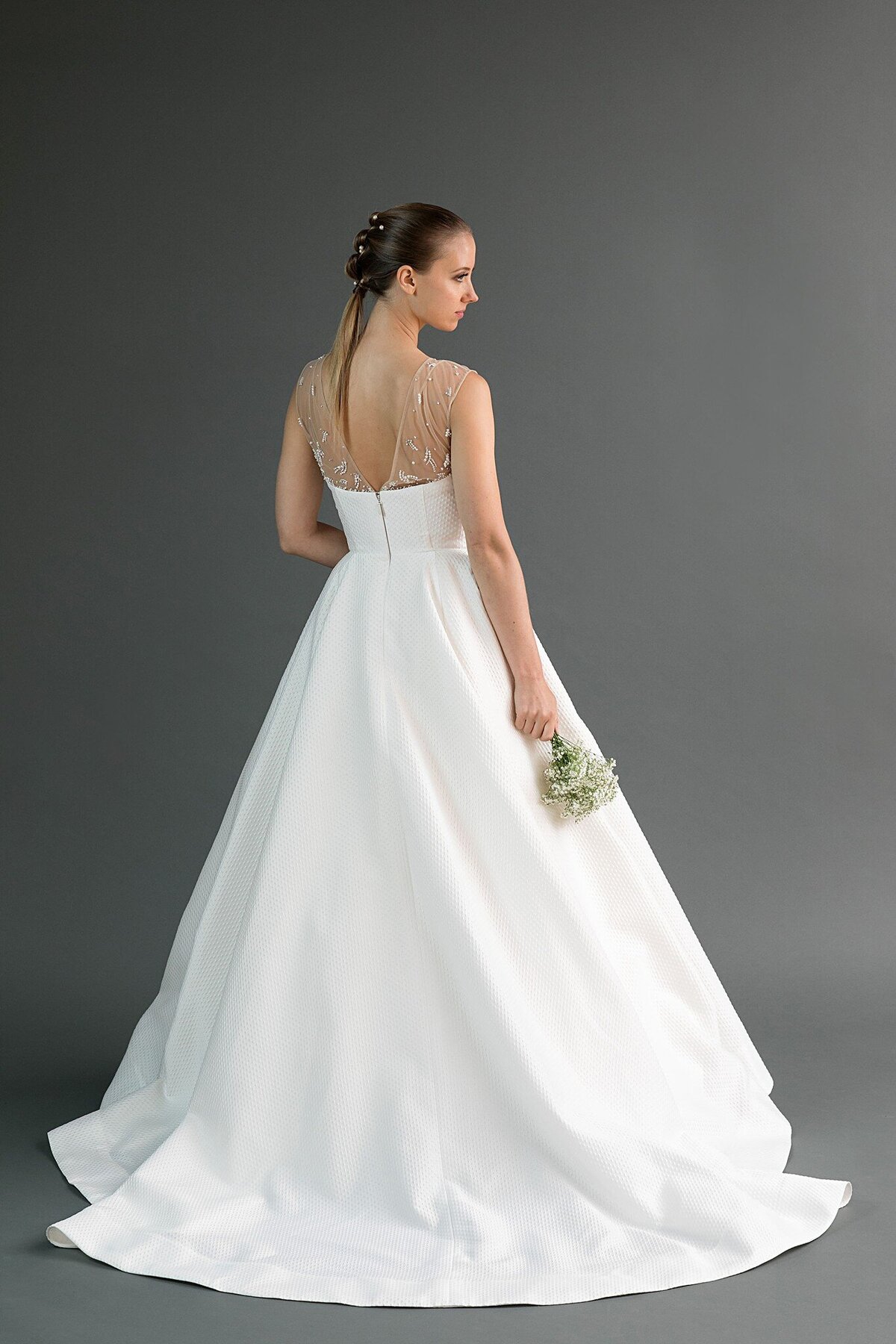 The body of this modern ballgown wedding dress is made from a textured dot jacquard.