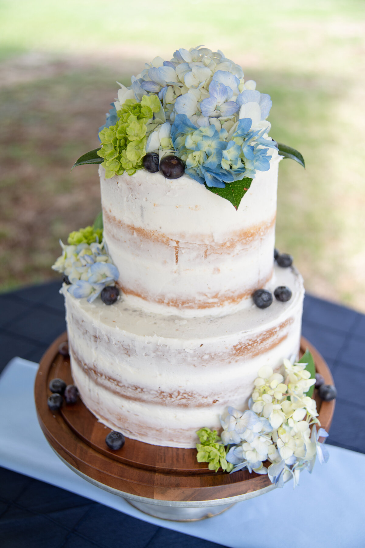 Rustic wedding cake with hydrangeas in Wells Maine