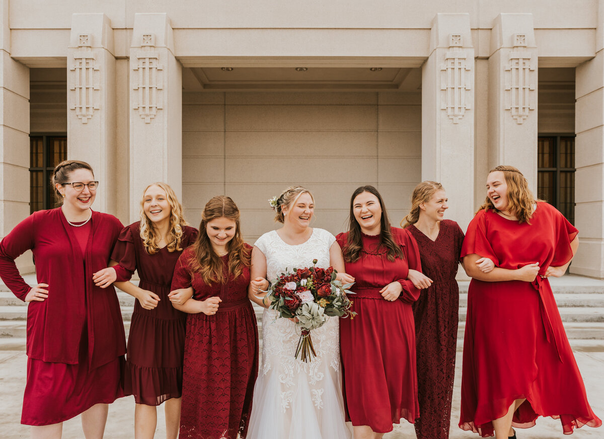 Utah Wedding Photographer takes photo of all the bridesmaids in front of the Meridian Idaho Temple