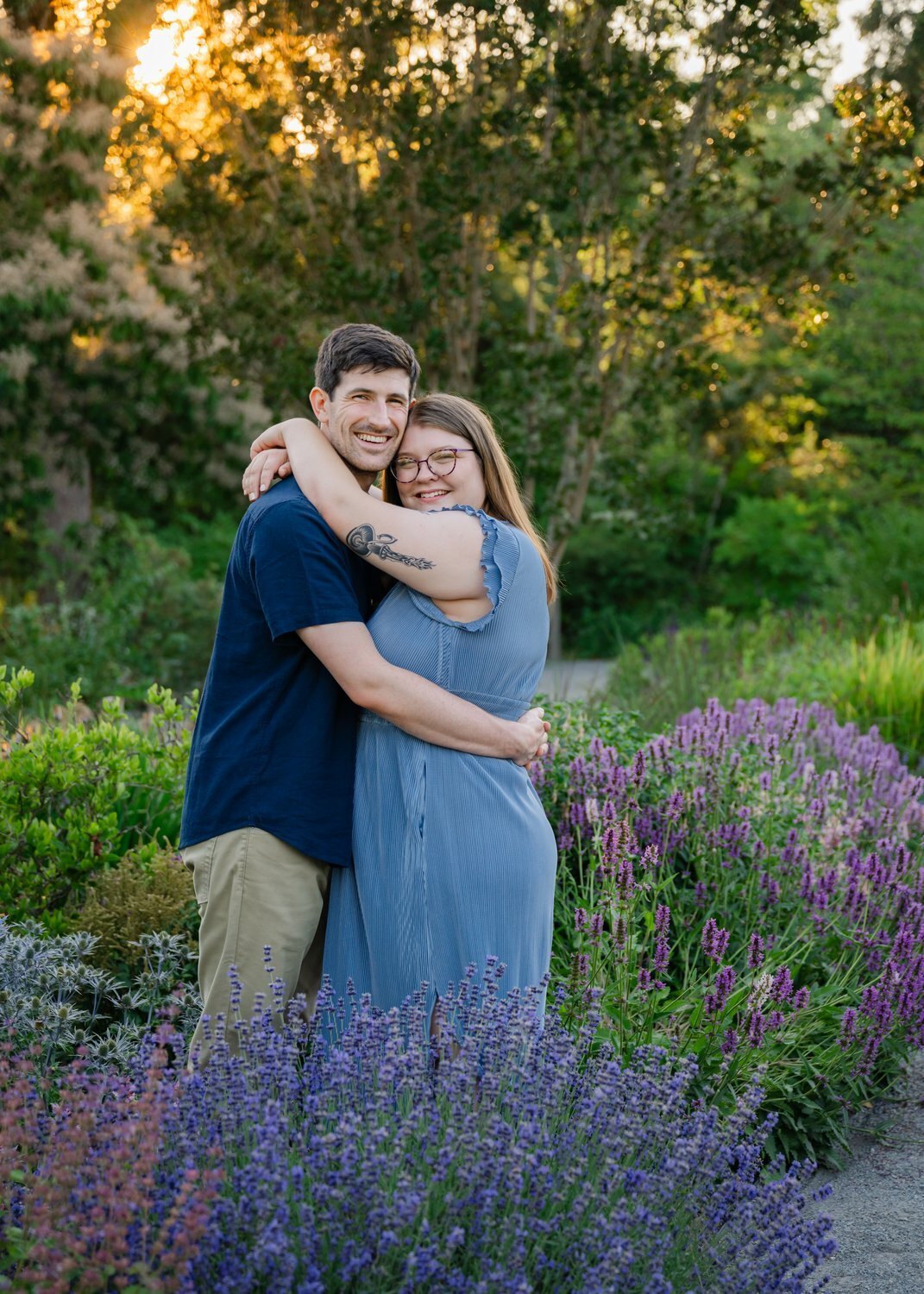 engaged couple hug in lavender at bellevue garden