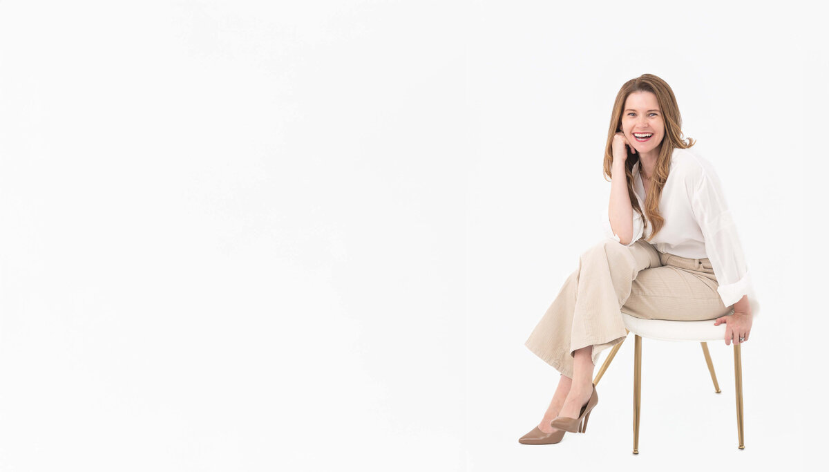 adorable one year old baby in white sitting in white bowl with white studio background