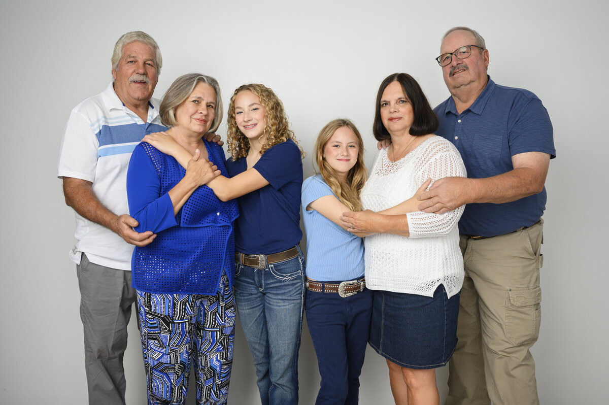 A loving family portrait with multiple generations, beautifully captured by Leslie Q Photography