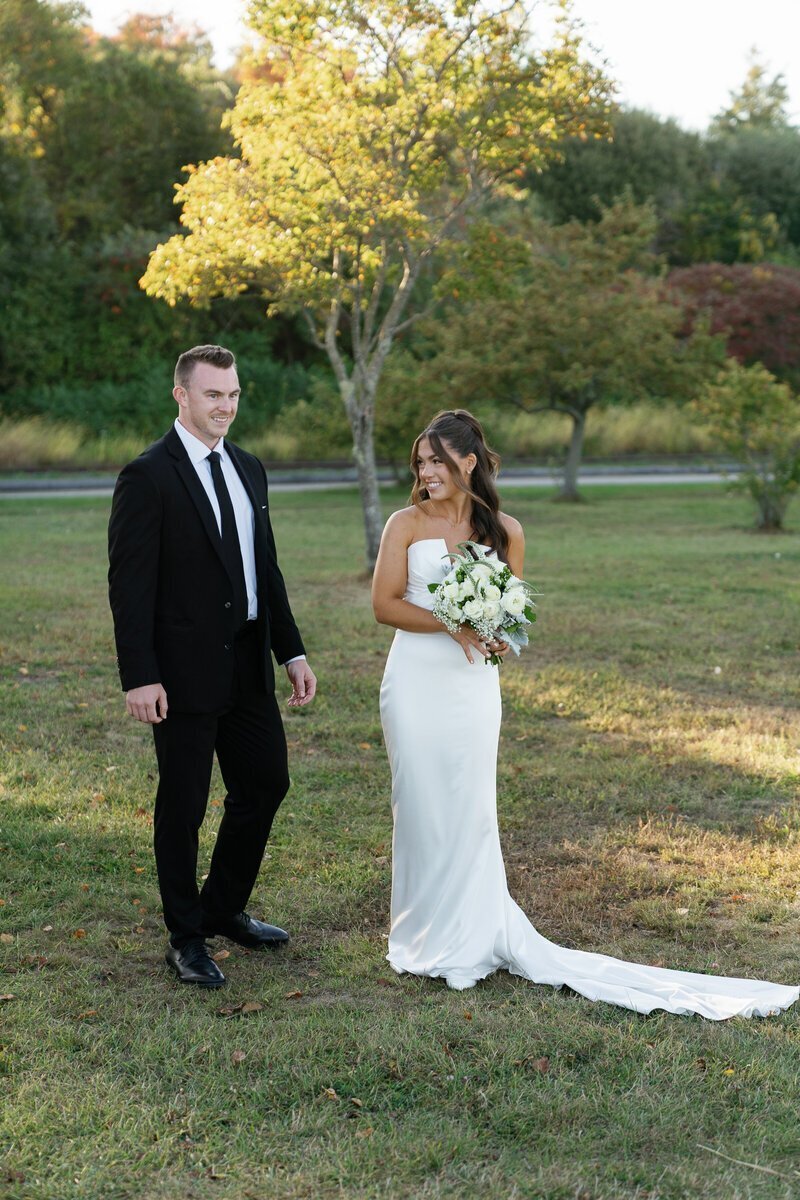 Bride and groom standing together in a park by Shelby Ann Photos, best wedding photographers in jacksonville fl