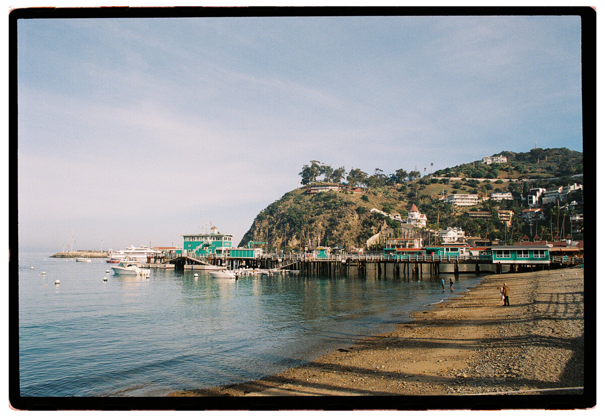Catalina Island pier captured on film by Kate Winters Photography, showcasing the scenic beauty in an authentic, documentary style.
