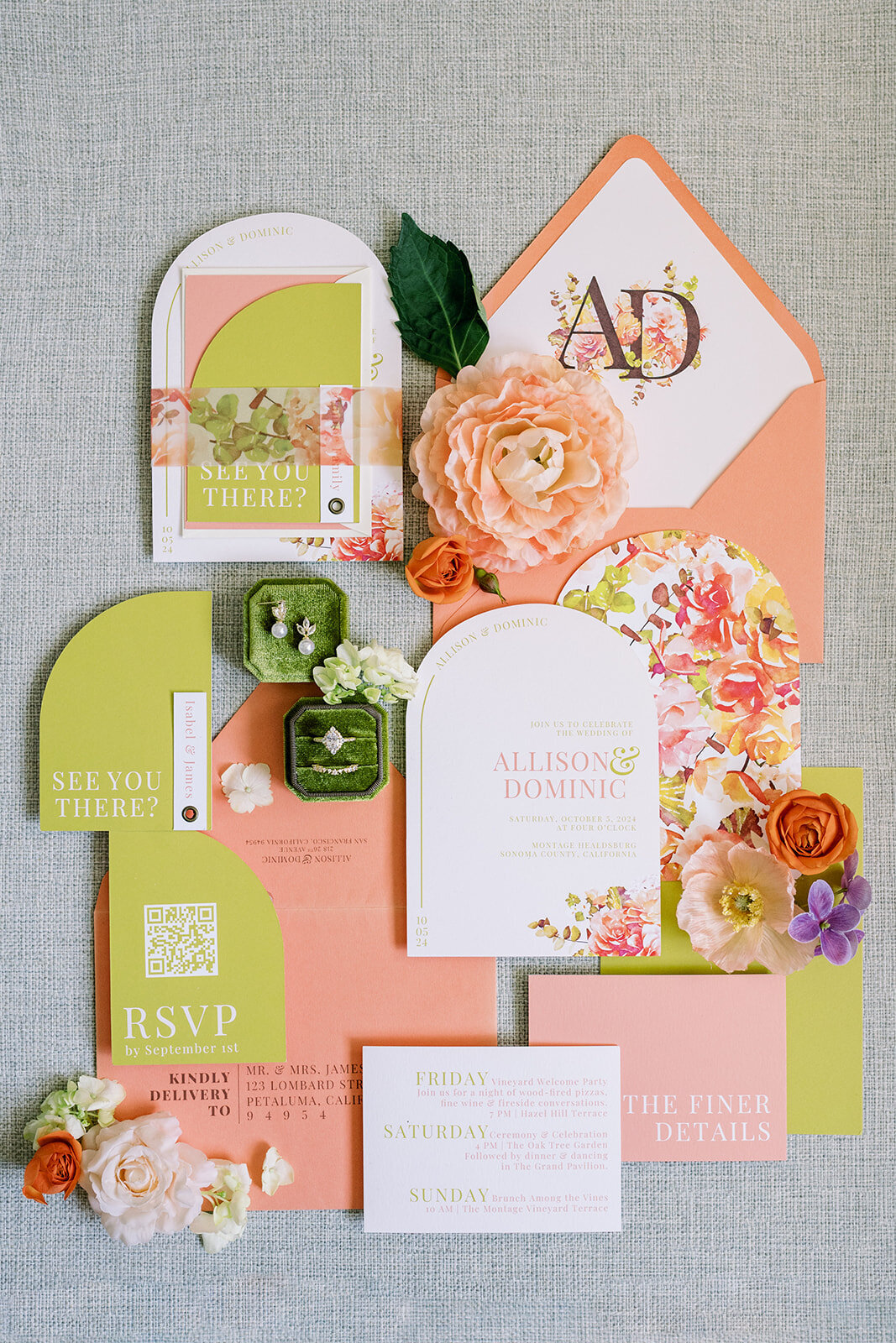 Modern colorful wedding stationery suite featuring bold coral and green designs, floral details, and custom die-cut pieces.