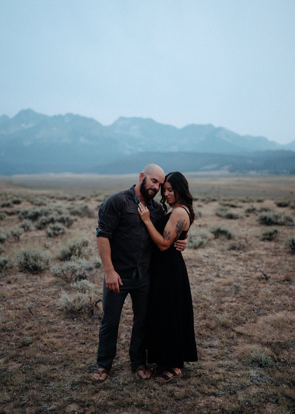 Couple during golden hour engagement shoot in Stanley, Idaho wedding/elopement - photographed by The Storytellers