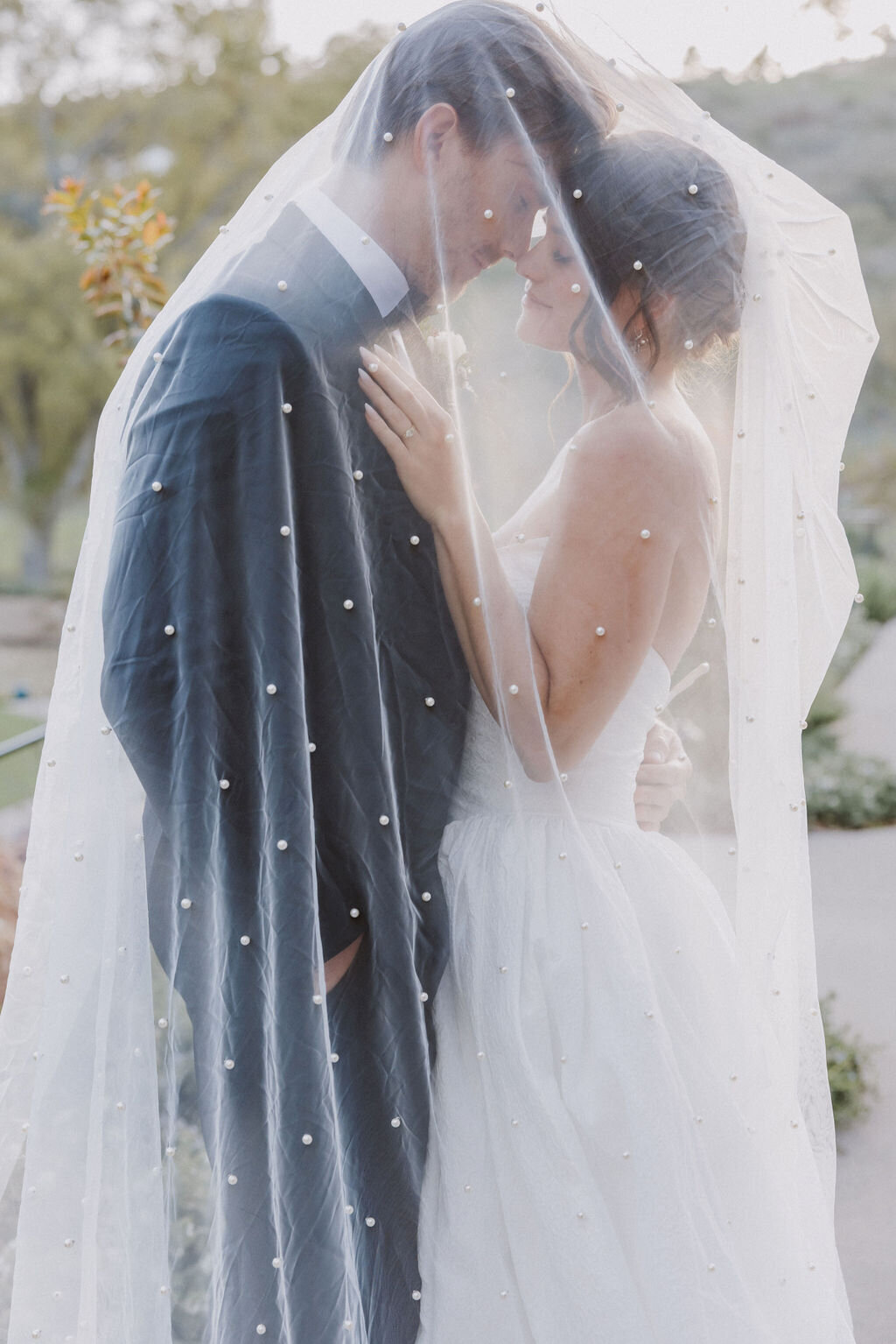 bride and groom under veil monserate winery wedding editorial, timeless, candid
