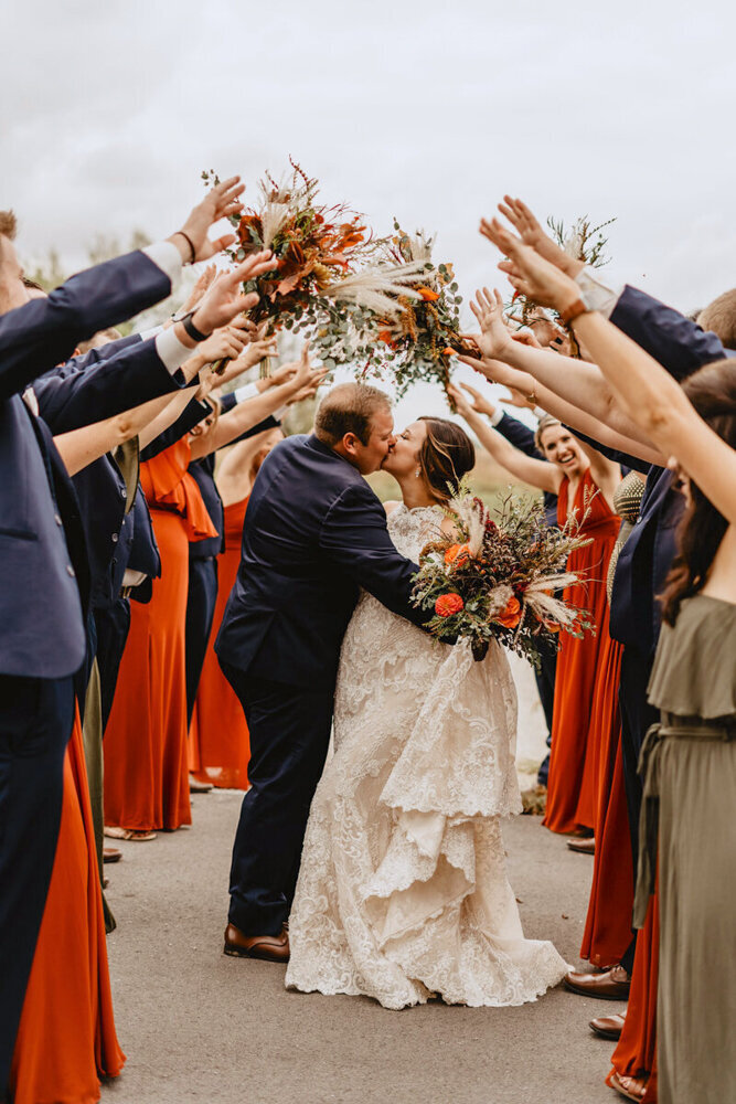 wedding-party-couple-kissing-hickory-grove-park-colo-iowa-des-moines-wedding-photographer-storyteller-collective-photo-co