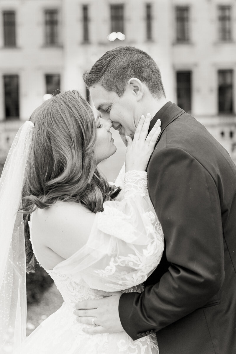 Bride and groom posing for a traditional wedding portrait at Château Challain, captured in elegant, timeless fine-art wedding photography