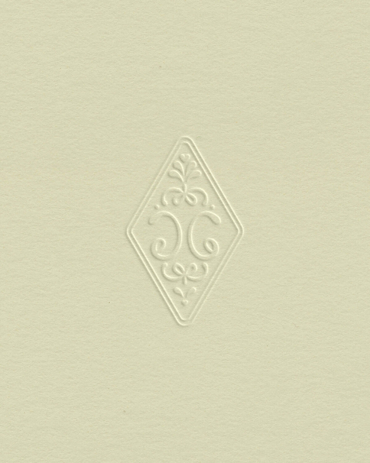 Elegant, hand drawn, embossed monogram logo with vintage detailing for refined, timeless brand identities that attract premium photography clients.
