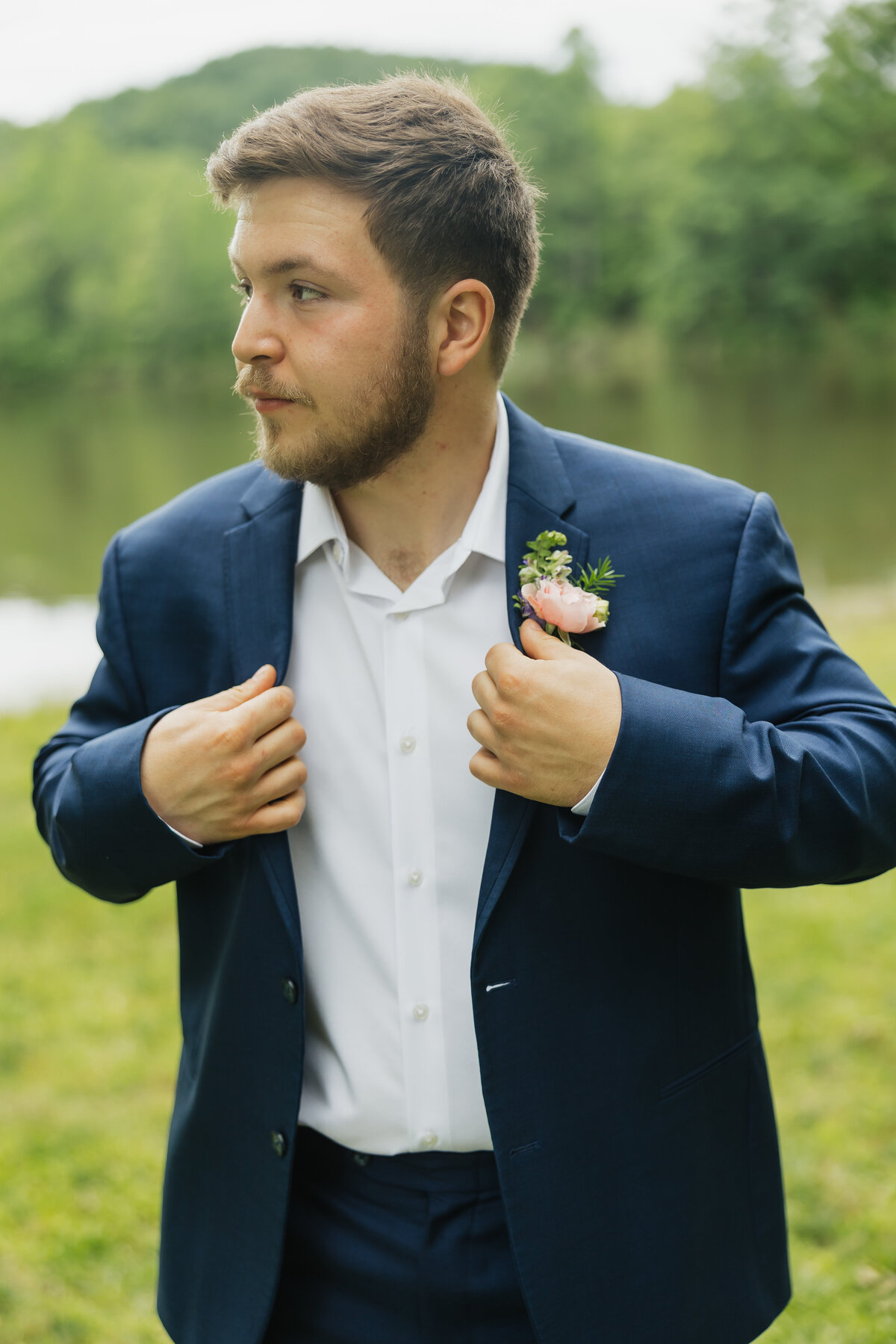 Groom with colorful boutonniere designed by Abby Grace Florals at Dahlonega GA wedding