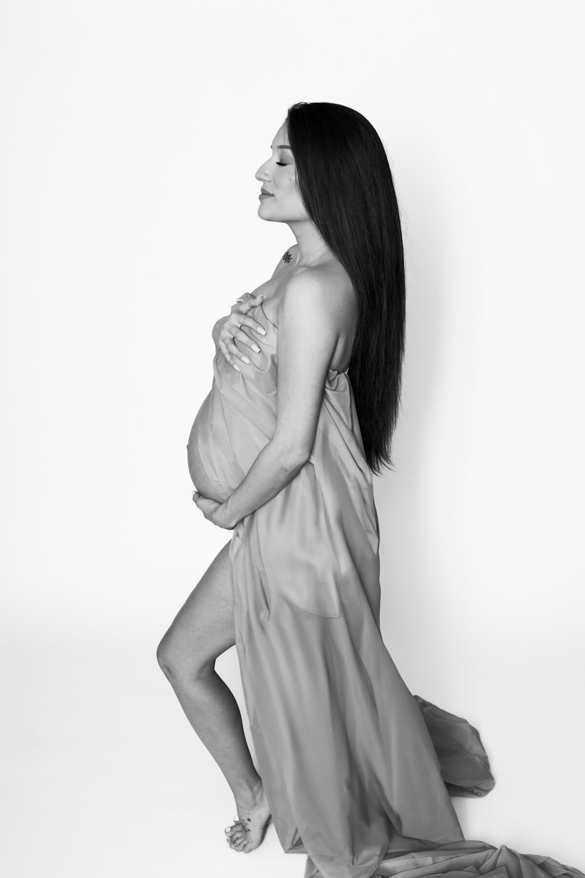 Austin Texas Maternity Studio Photo of Woman with drape.