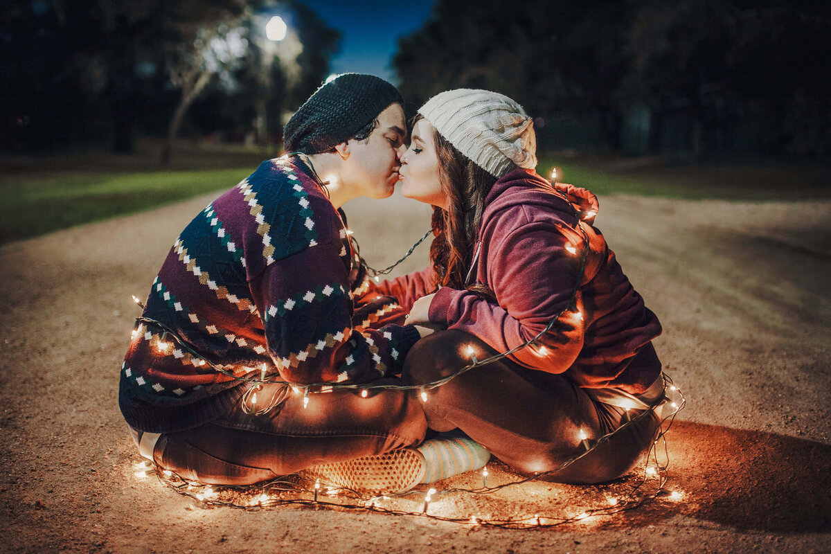 Engagement session photo of a couple celebrating indoors at an Orlando photography location.