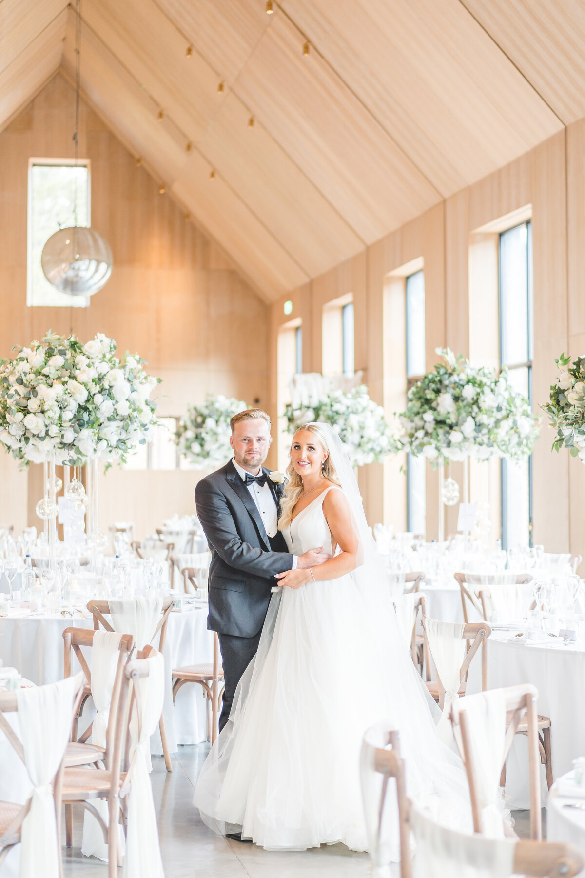 Bride and groom in reception room at Dorfold Hall