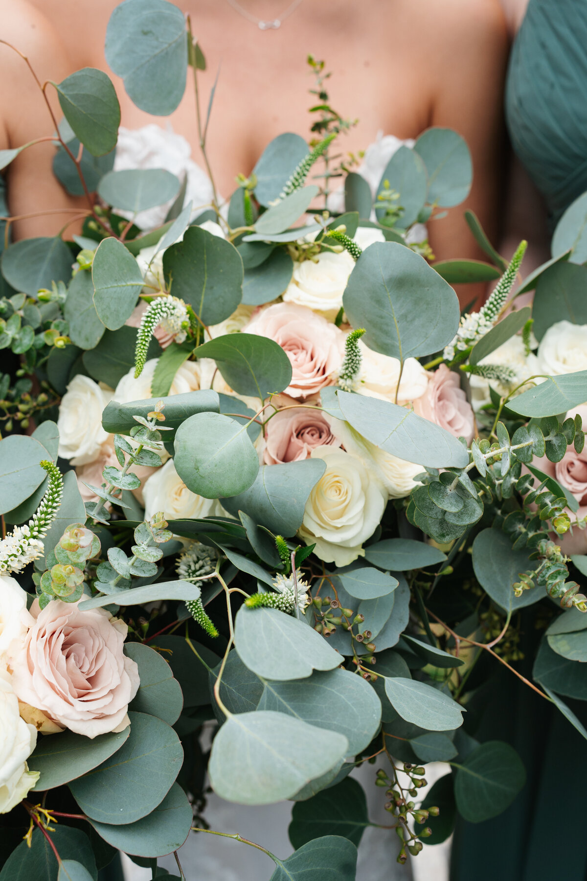 Bride and groom walking hand in hand at their outdoor New England wedding