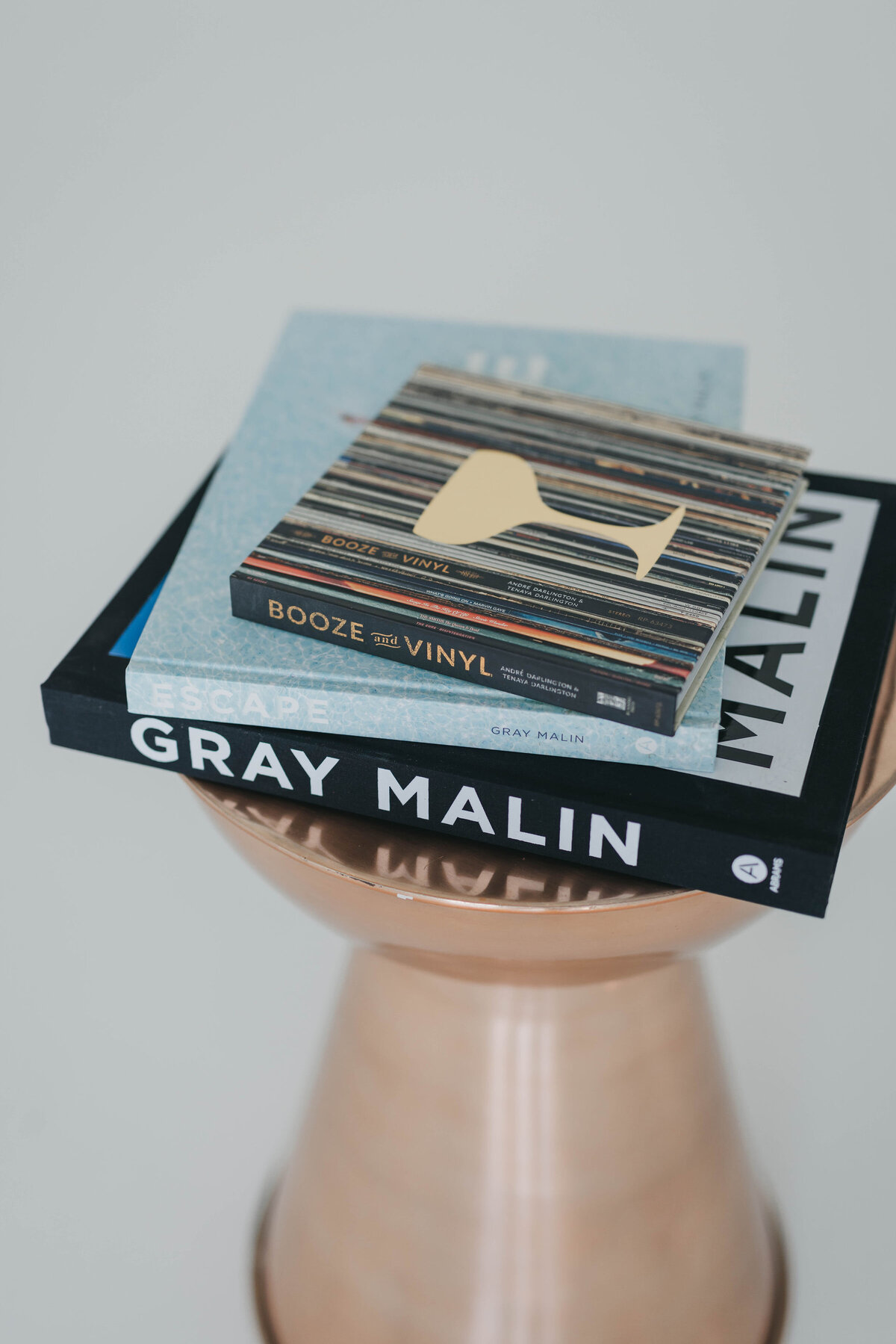 stack of books on Gray Malin