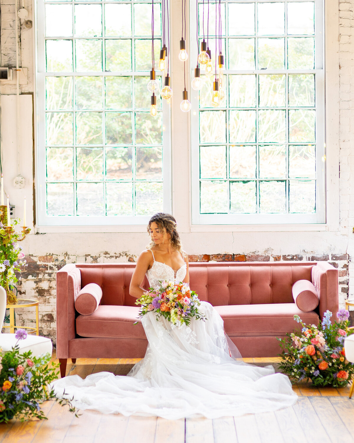 Bride looking down at her wedding veil