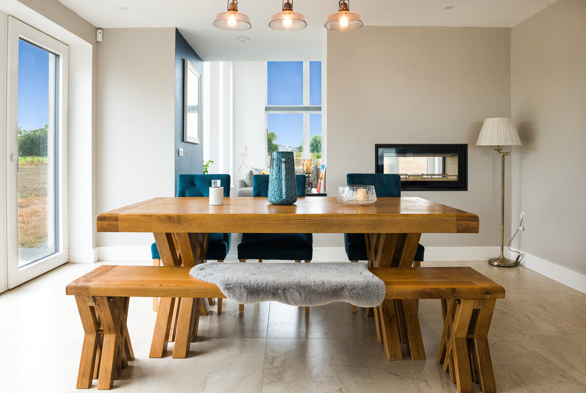 Scandi style dining room with double sided wood burning stove