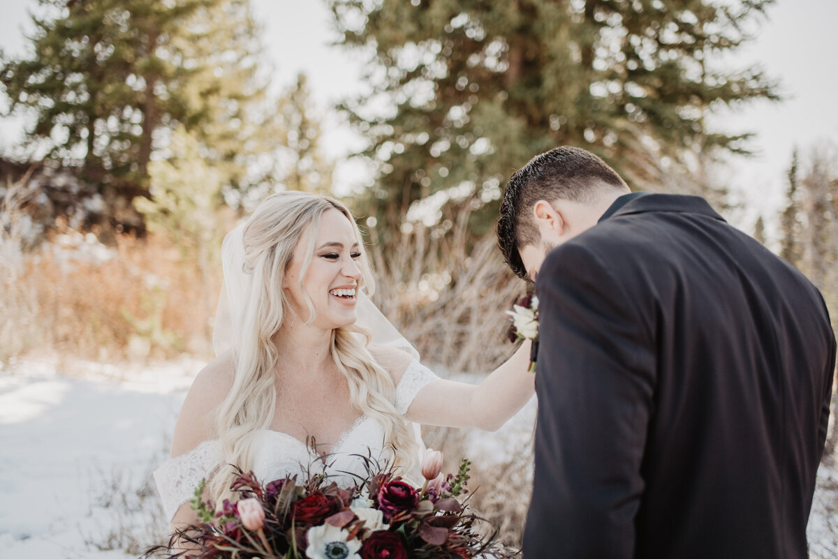 Jackson Hole Photographers capture bride wiping groom's tears during first look