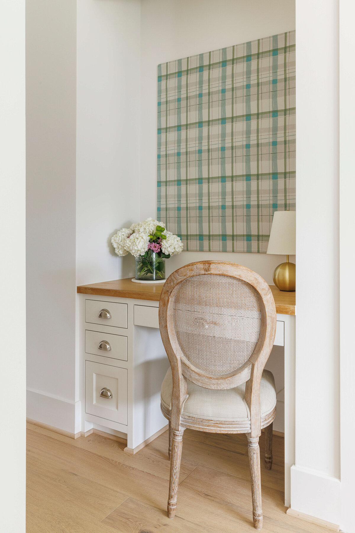 oyster creek studios missouri city new build white corner desk with wooden counter with plaid wall and wicker chair