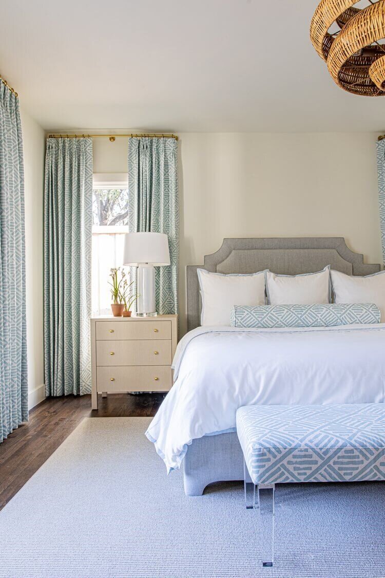 oyster creek studios highland park home white bed with light wooden side table in bedroom