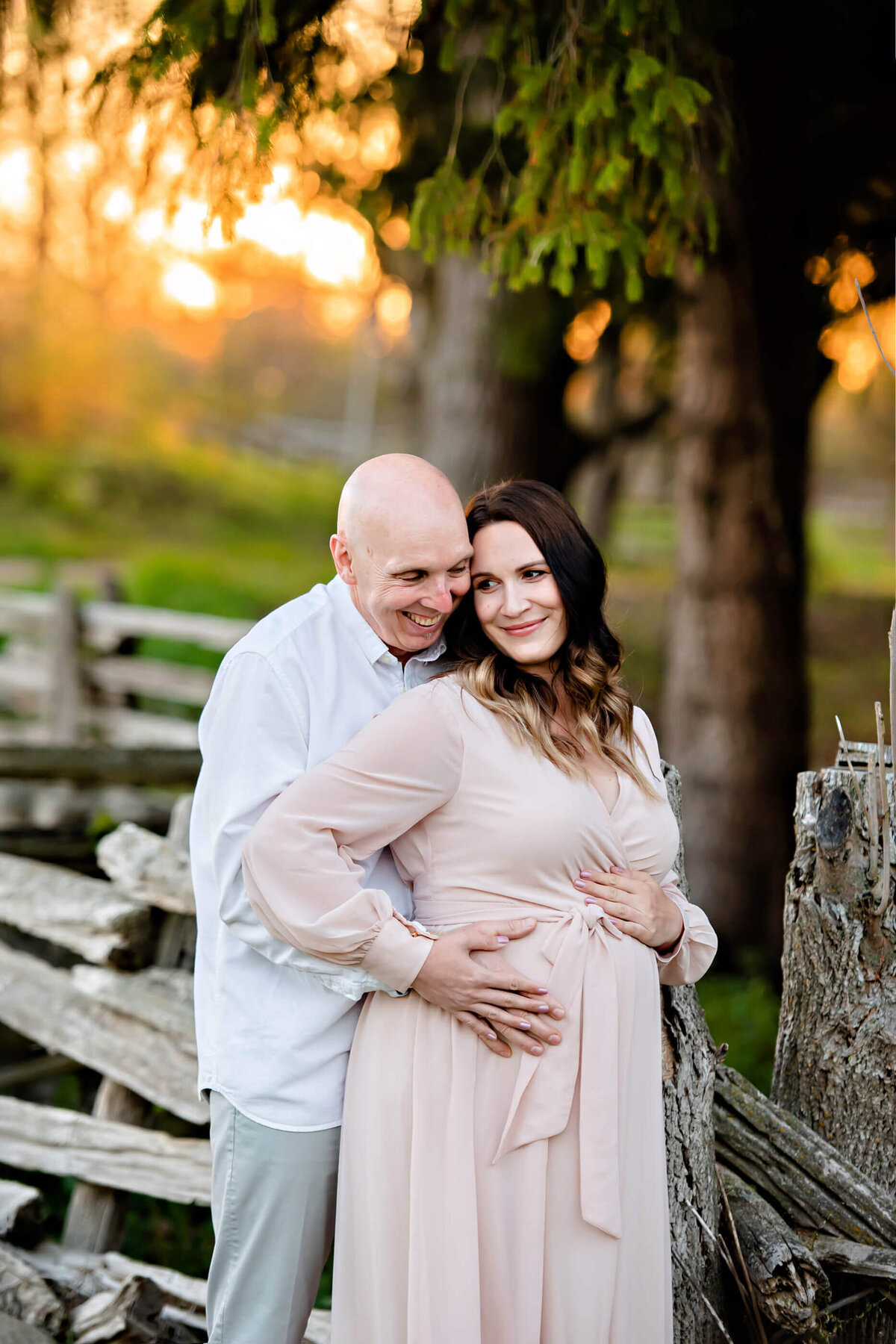 husband and wife for their Toronto farm Summer Maternity Session