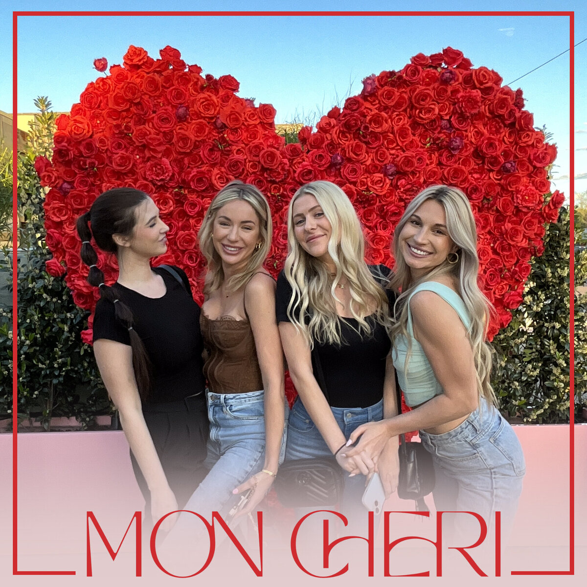 Group of women posing in front of a red rose heart wall at Mon Cheri in Scottsdale, Arizona—captured by MISGIF’s leased Selfie Station photo booth, perfect for retail activations and permanent brand installations.