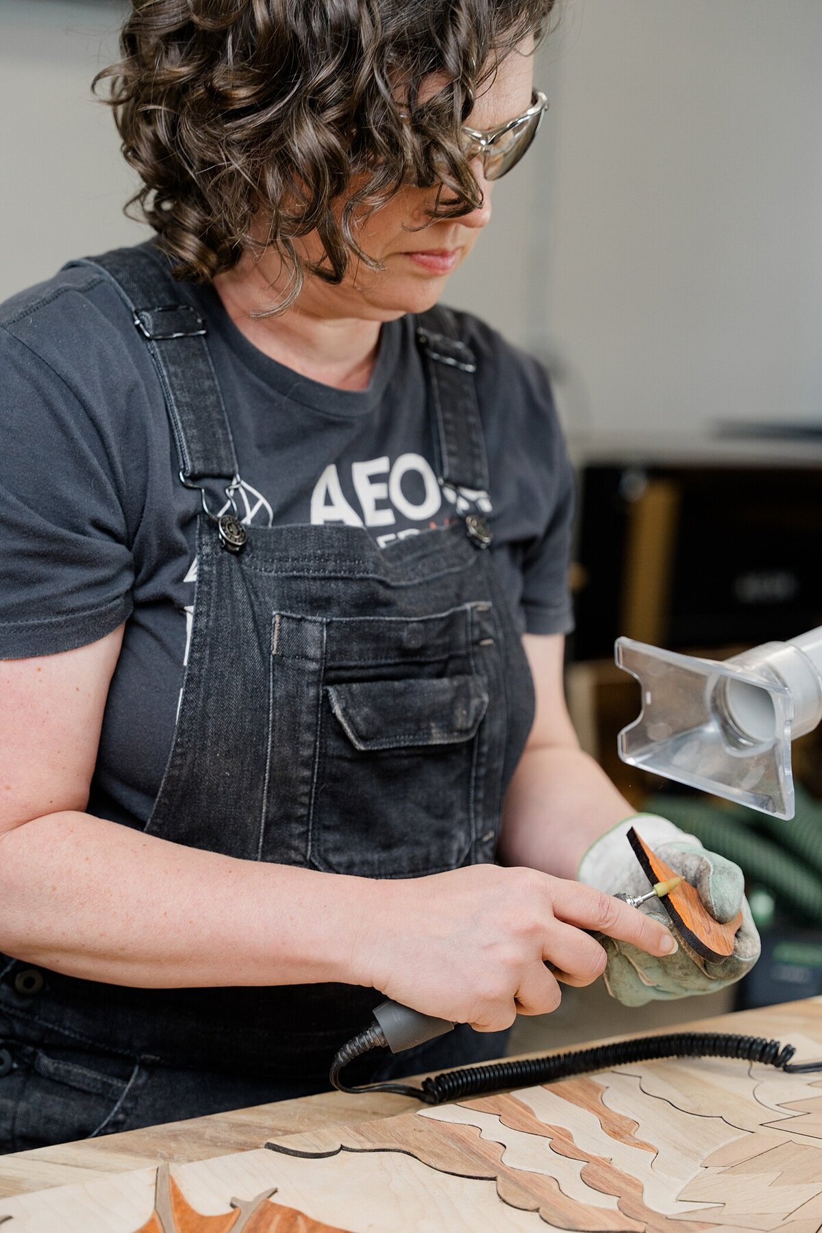 branding photos of behind the scenes of a small business owner producing a woodworking product