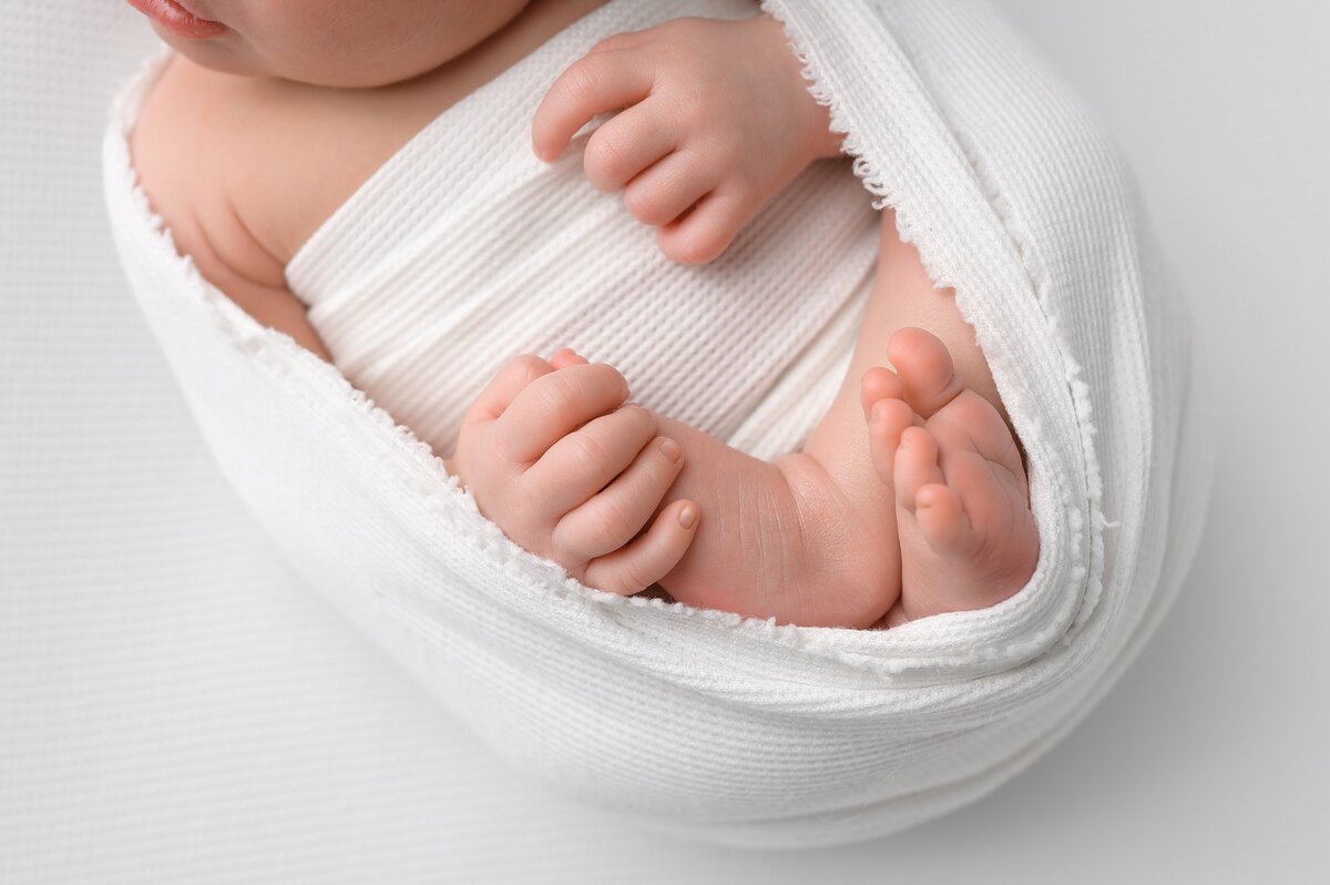 Professional photographer captures newborn details during baby photoshoot in Palm Beach.