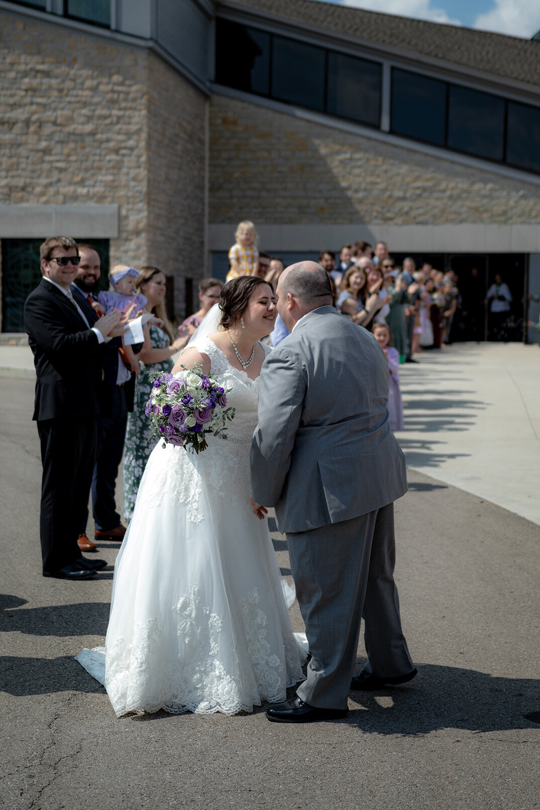 bride-and-groom-share-a-kiss-during-bubble-exit