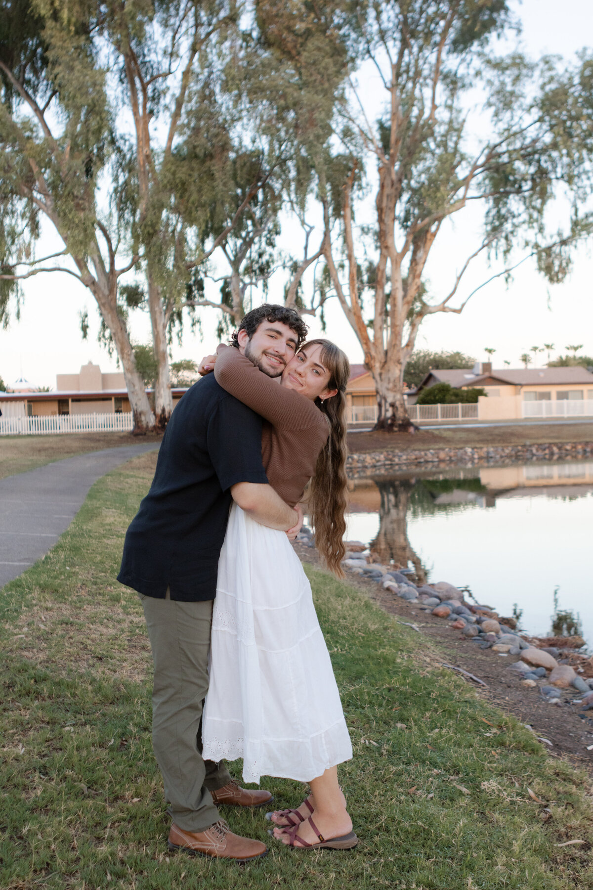 Jovanna G Photography. Classic, sophisticated Wedding Photos. Soft romantic engagement photos. Soft romantic WeddingPhotos. Sophisticated Wedding Photographer. Professional Wedding Photographer. Destination Wedding Photographer. Luxury Wedding photographer. Traveling Wedding Photographer. AZ Wedding Photographer. Gilbert AZ Wedding Photographer. Queen Creek Wedding Photographer. Phoenix Wedding Photographer. Scottsdale Wedding Photographer. Flagstaff Wedding Photographer. SoCal Wedding Photographer. California Wedding Photographer. Northern California Wedding Photographer. Southern California Wedding Photographer. San Francisco Wedding Photographer. Bay Area Wedding Photographer. San Jose Wedding Photographer. Golden Gate Bridge Wedding Photographer. Beach Lover Wedding Photographer. Palace of the Fine Arts Wedding Photographer. Ocean Lover. I love California. Orange County Wedding Photographer. Newport Beach Couples Photographer. Newport Beach Wedding Photographer. Laguna Beach Couples Beach Engagement Photographer. Laguna Beach wedding beach photographer. Los Angeles Wedding Photographer. Young and in love engaged couples who live in southern California. Christian Young Couple. Young Engaged Couple. Engaged High School Christian Couple. Christian Values. Young conservative Christian women. Young Conservative Christian men. Young Conservative Christian Couple. Young Christian Couple Engaged in High School. Young Christian College Couple. Lakeside Lovers in the Autumn Sun. David & Grace - engagement photos. Jovanna G Photographer Engagement Photos. Arizona sun shining through autumn trees- engagement. Chandler, AZ Engagement Photos. Chandler, AZ 2026 bride. Chandler, AZ Wedding Photographer. Chandler, AZ Young Engaged Couple. Girl in her 20s. Engaged Arizona Girl in her 20s. Lakeside Engagement photos. AZ Lakeside Engagement Photos. AZ Weeping Willow Lakeside Proposal. Arizona Lakeside Proposal with weeping willow tree. Detail shot of engagement ring on Arizona Lakeside estate. Chandler, AZ Lakeside Estate Proposal Outfit Inspiration.
