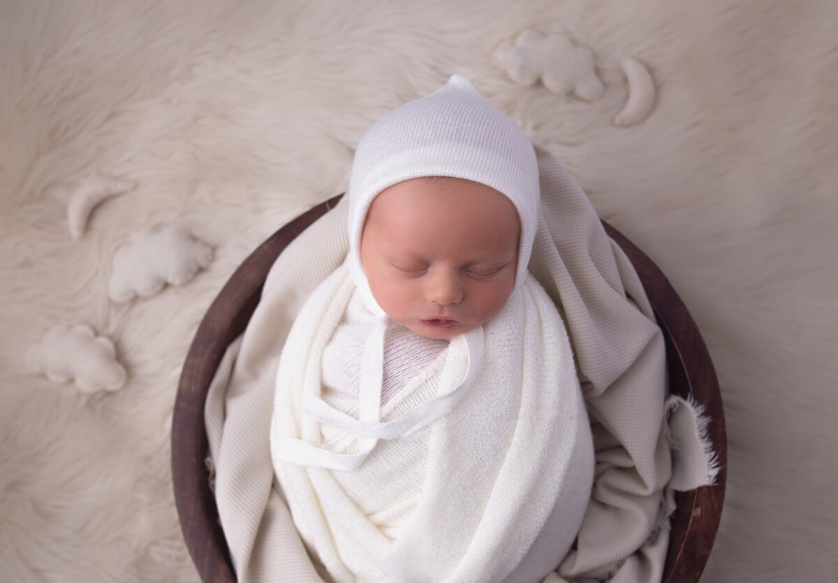 newborn baby wrapped in white wrap during newborn photoshoot with mt Juliet Tennessee photographer 