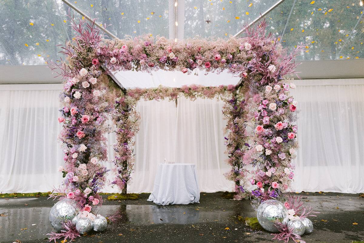 gorgeous-dsuty-rose-pink-pastel-ceremony-arch-flowers-with-disco-ball-wedding-ceremony-decor-enza-events