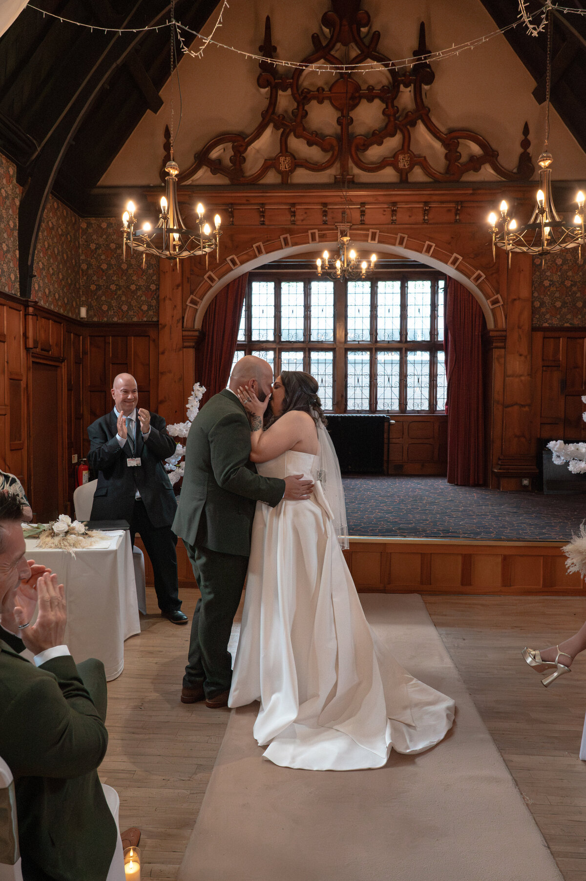 Bride and groom's first kiss during ceremony at Worsley Court House Manchester wedding photographer