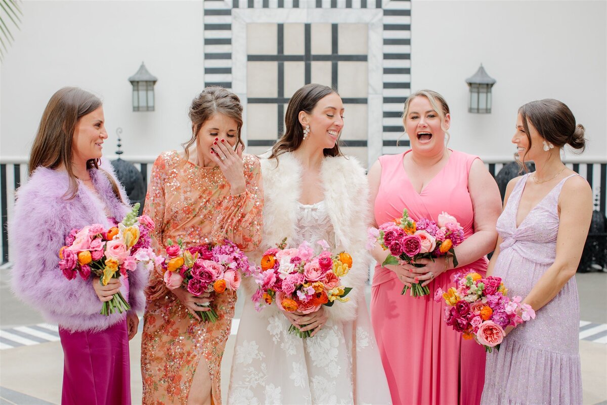 bride with bridesmaids holding bouquet