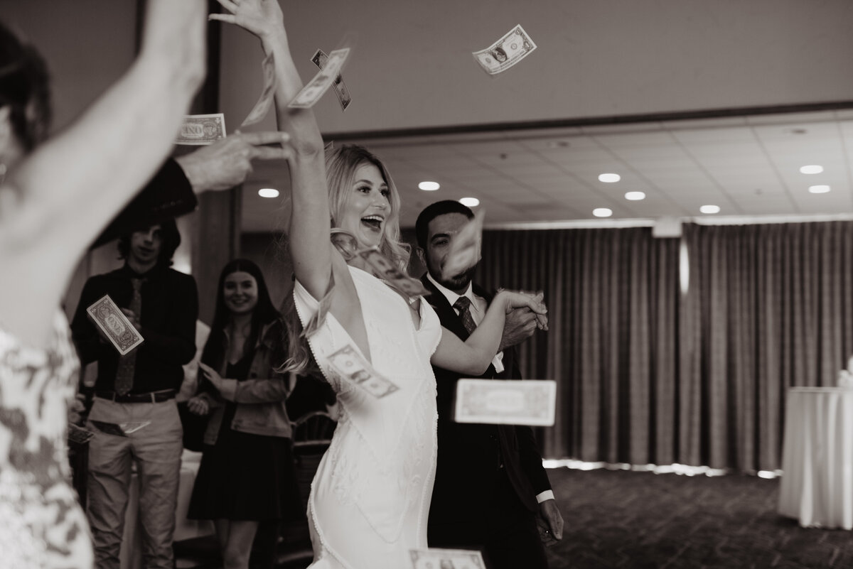 Photographers Jackson Hole capture bride doing money dance