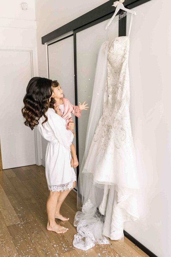 bride-and-daughter-looking-at-dress