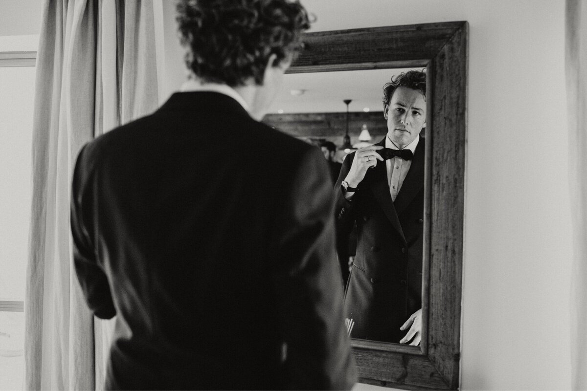 Black and white groom portrait at Gara Rock hotel